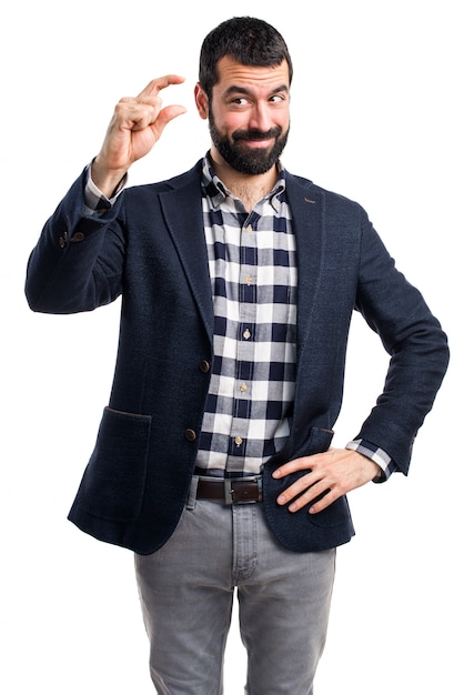 Handsome man doing tiny sign