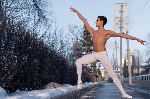 Handsome man in elegant ballet position