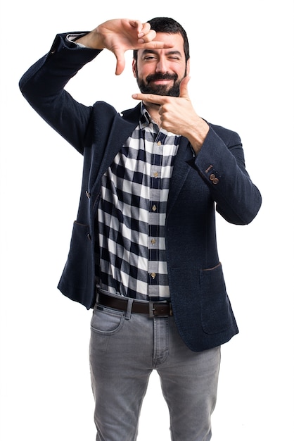 Handsome man focusing with his fingers