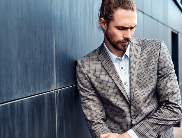 Free Photo handsome man in gray checkered suit