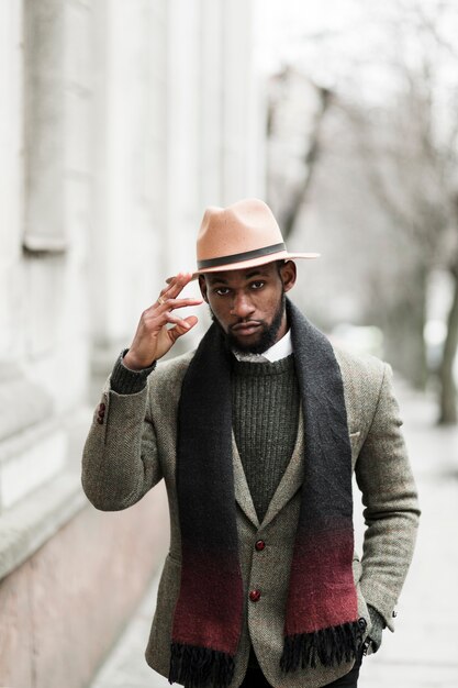 Handsome man in grey jacket walking