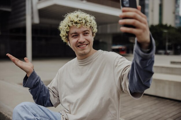 Free Photo handsome man holding a phone