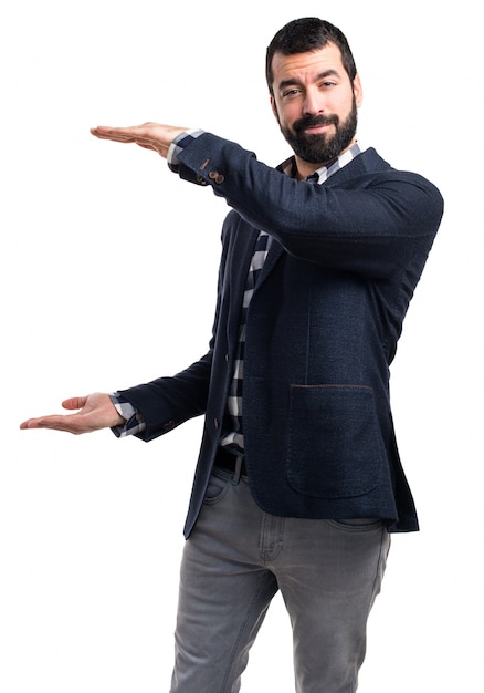 Handsome man holding something