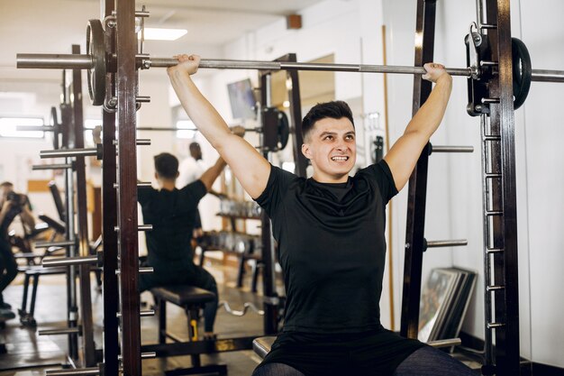 A handsome man is engaged in a gym