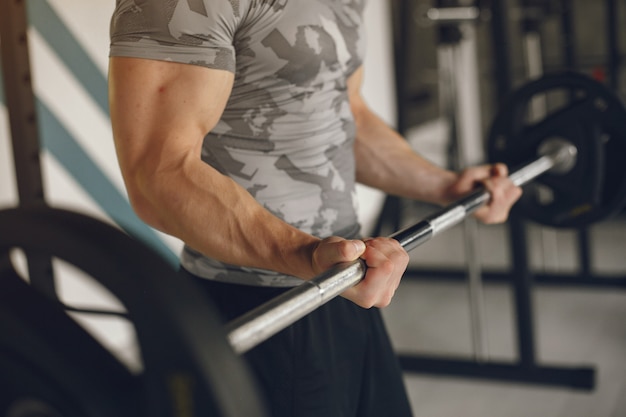 A handsome man is engaged in a gym