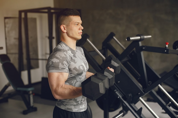 A handsome man is engaged in a gym