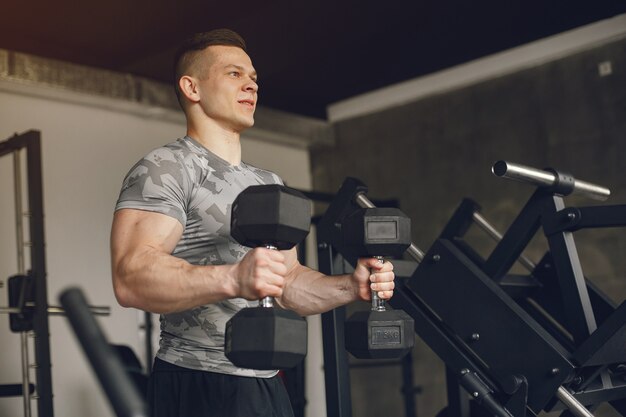 A handsome man is engaged in a gym