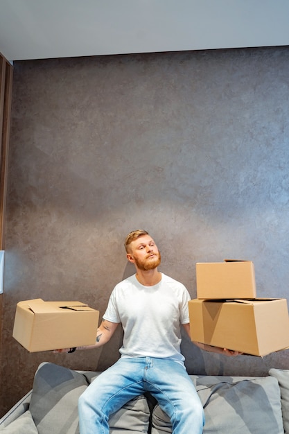 Handsome man is preparing a few boxes