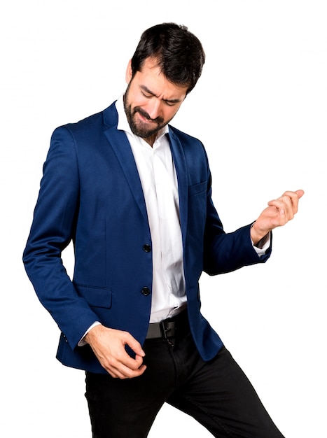 Handsome man making guitar gesture