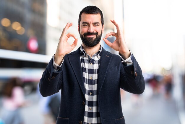 Handsome man making OK sign