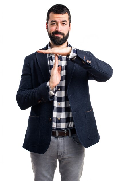 Handsome man making time out gesture