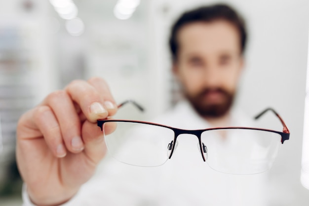 Handsome man in a optics shop