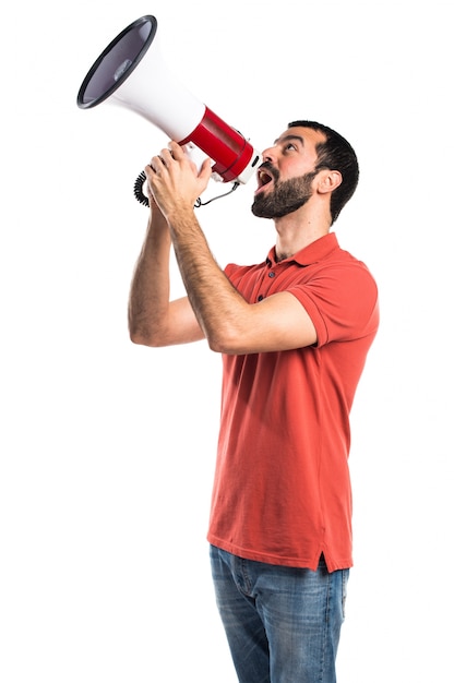 Handsome man shouting by megaphone