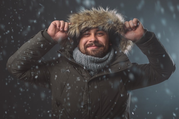 Handsome man in snow storm