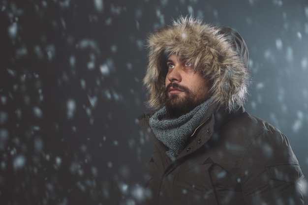 Handsome man in snow storm