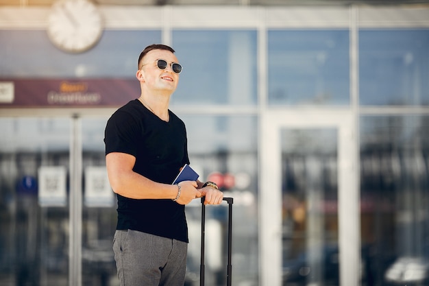 Handsome man standing in airport