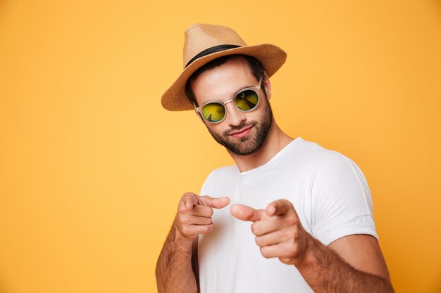 Handsome man in summer hat looking