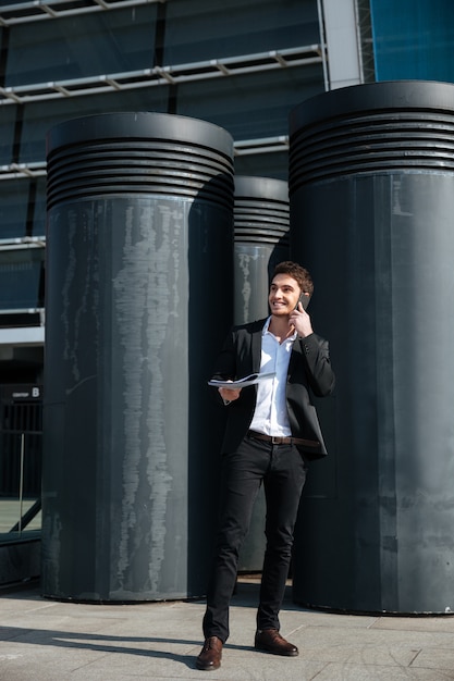 Free Photo handsome man talking on phone