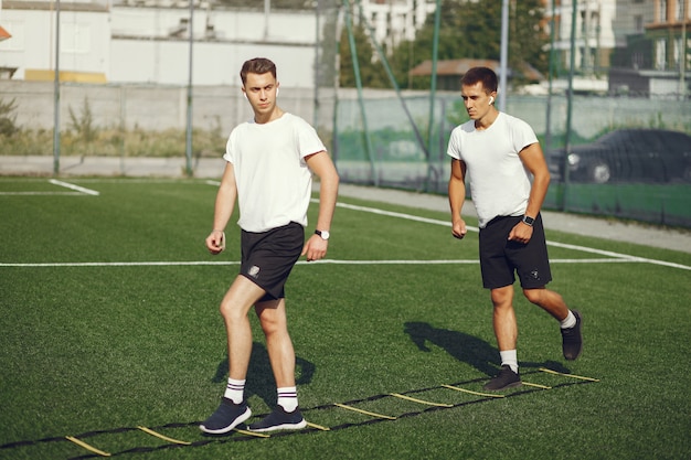 Handsome man training in a summer park