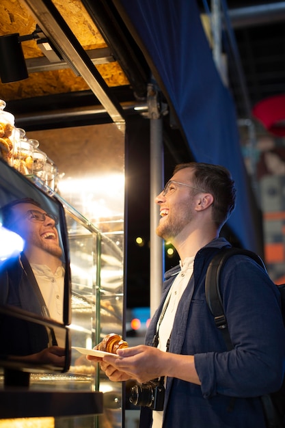 Free photo handsome man traveling in a local place