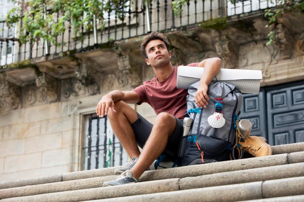 Handsome man traveling with his backpack