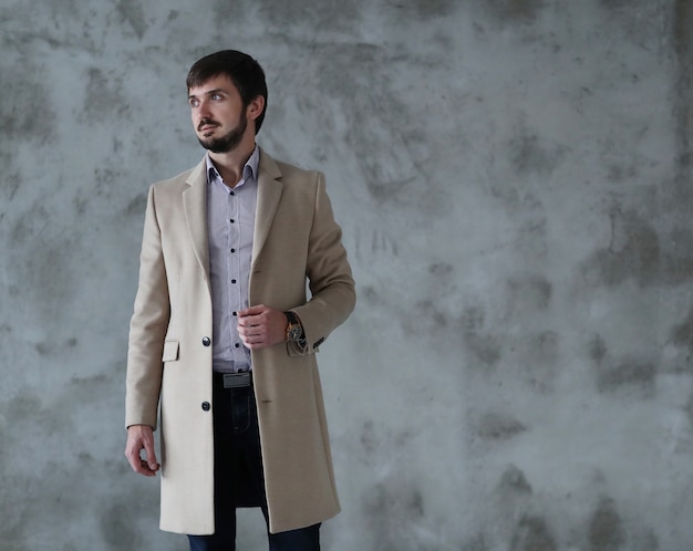 Free Photo handsome man wearing beige coat