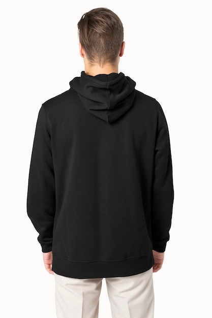 Free Photo handsome man wearing black hoodie for winter fashion rear view