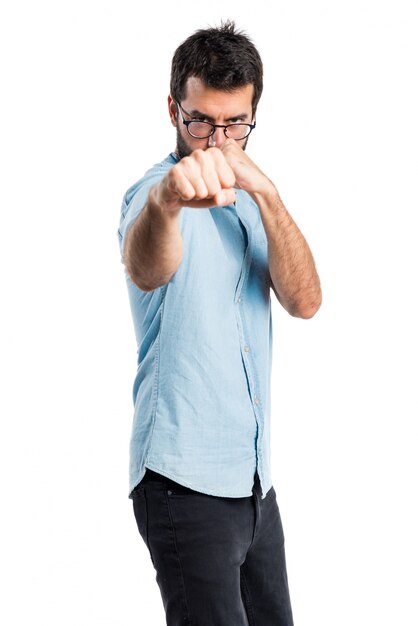 Handsome man with blue glasses giving a punch