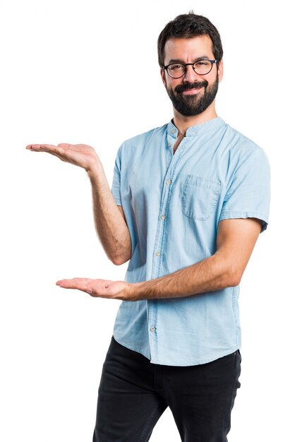 Handsome man with blue glasses presenting something