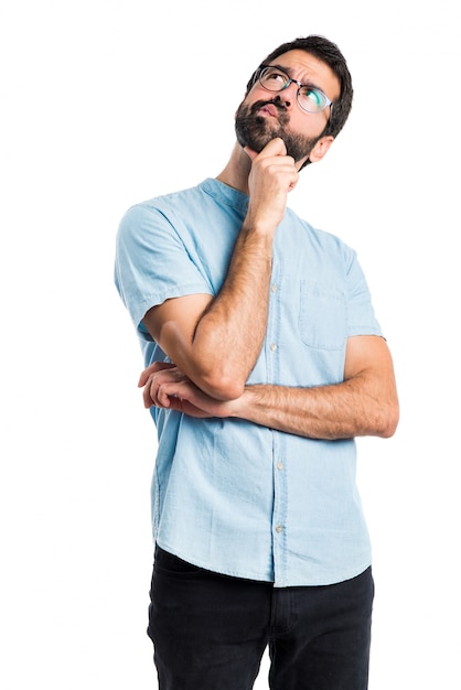 Handsome man with glasses thinking