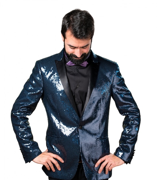 Handsome man with sequin jacket looking down