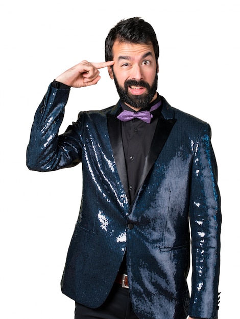 Free photo handsome man with sequin jacket making crazy gesture