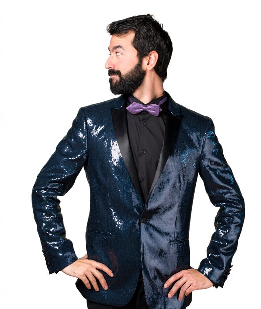 Handsome man with sequin jacket ooking lateral