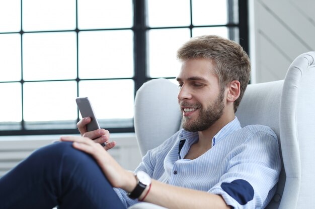 Handsome man with smartphone