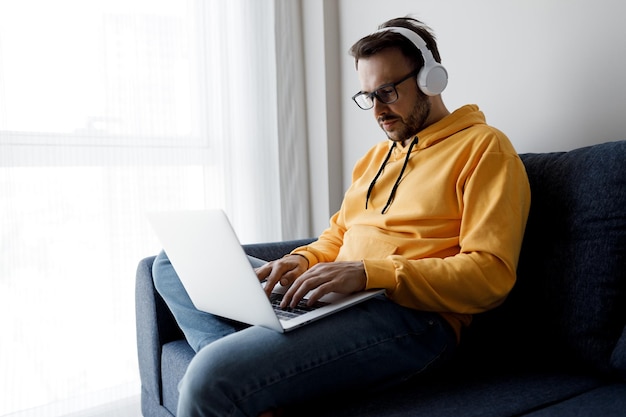 handsome man working with laptop at home