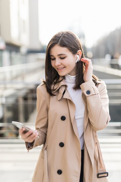 Handsome model put her wireless headphones on during videocall