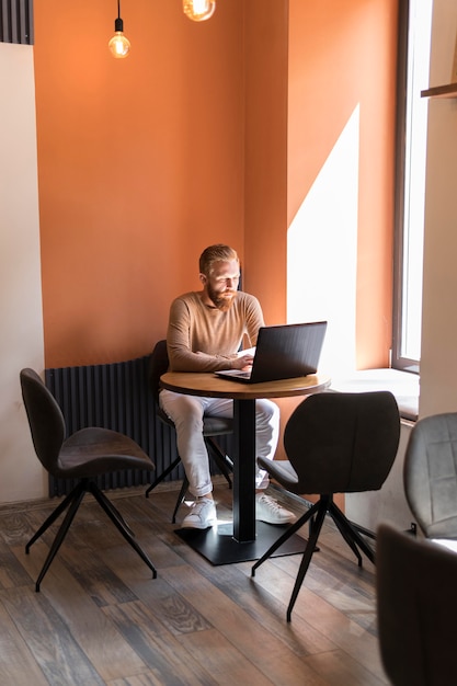 Free photo handsome modern man working at the office