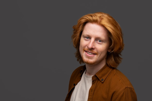 Handsome and sensitive red head man smiling