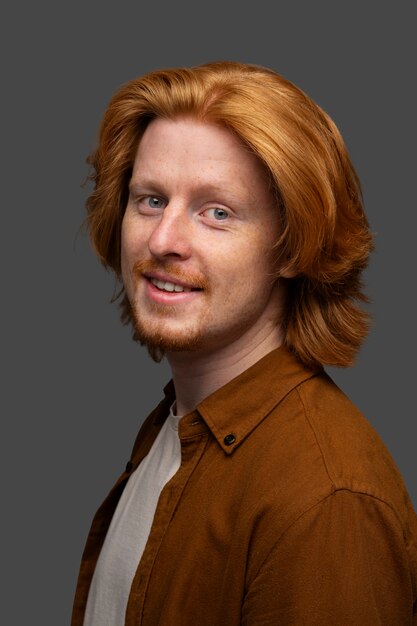 Handsome and sensitive red head man smiling