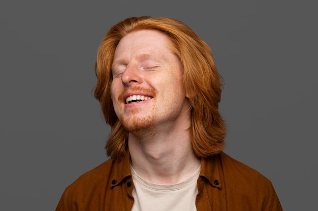 Handsome and sensitive red head man smiling