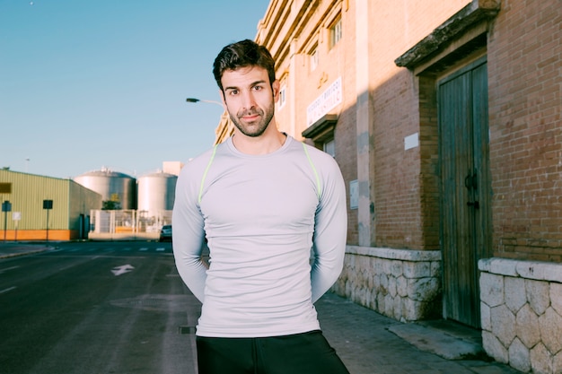 Handsome sportsman on street