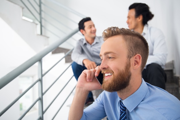 Free Photo handsome talking stairway conversation employee