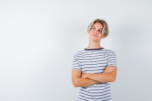 Handsome teen boy in a striped t-shirt