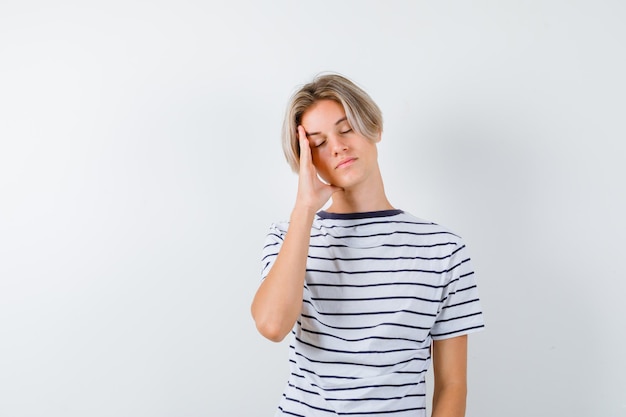 Handsome teen boy in a striped t-shirt