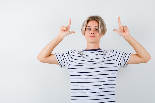 Free photo handsome teen boy in a striped t-shirt