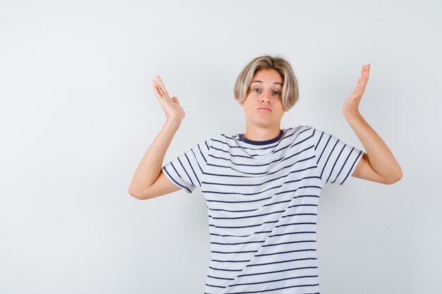 Handsome teen boy in a striped t-shirt