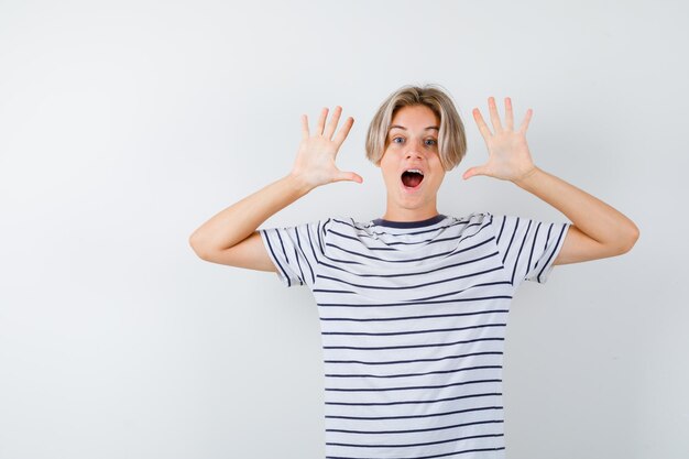 Handsome teen boy in a striped t-shirt