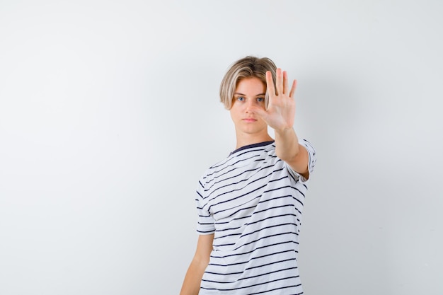 Handsome teen boy in a striped t-shirt