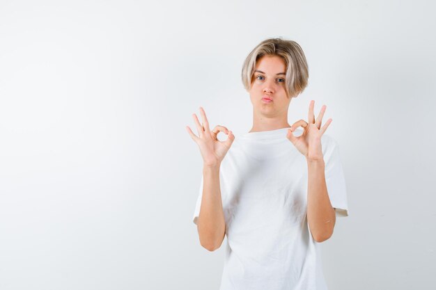 Handsome teen boy in a white t-shirt