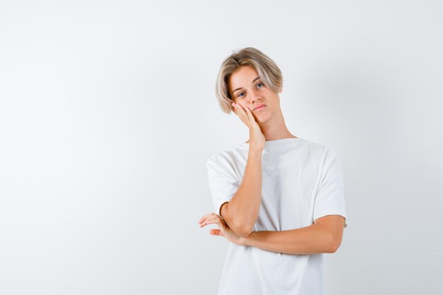 Handsome teen boy in a white t-shirt